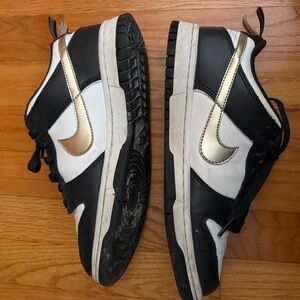 Nike Black and White Sneakers with Gold Swoosh